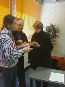 Ellen Kennedy and Bob Deluca get to hold a snake.