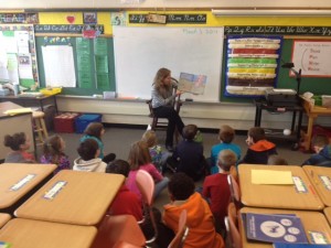 Mary Parkman, Service-Learning Coordinator, reading "The Lorax" by Dr. Seuss to a 4th grade class.